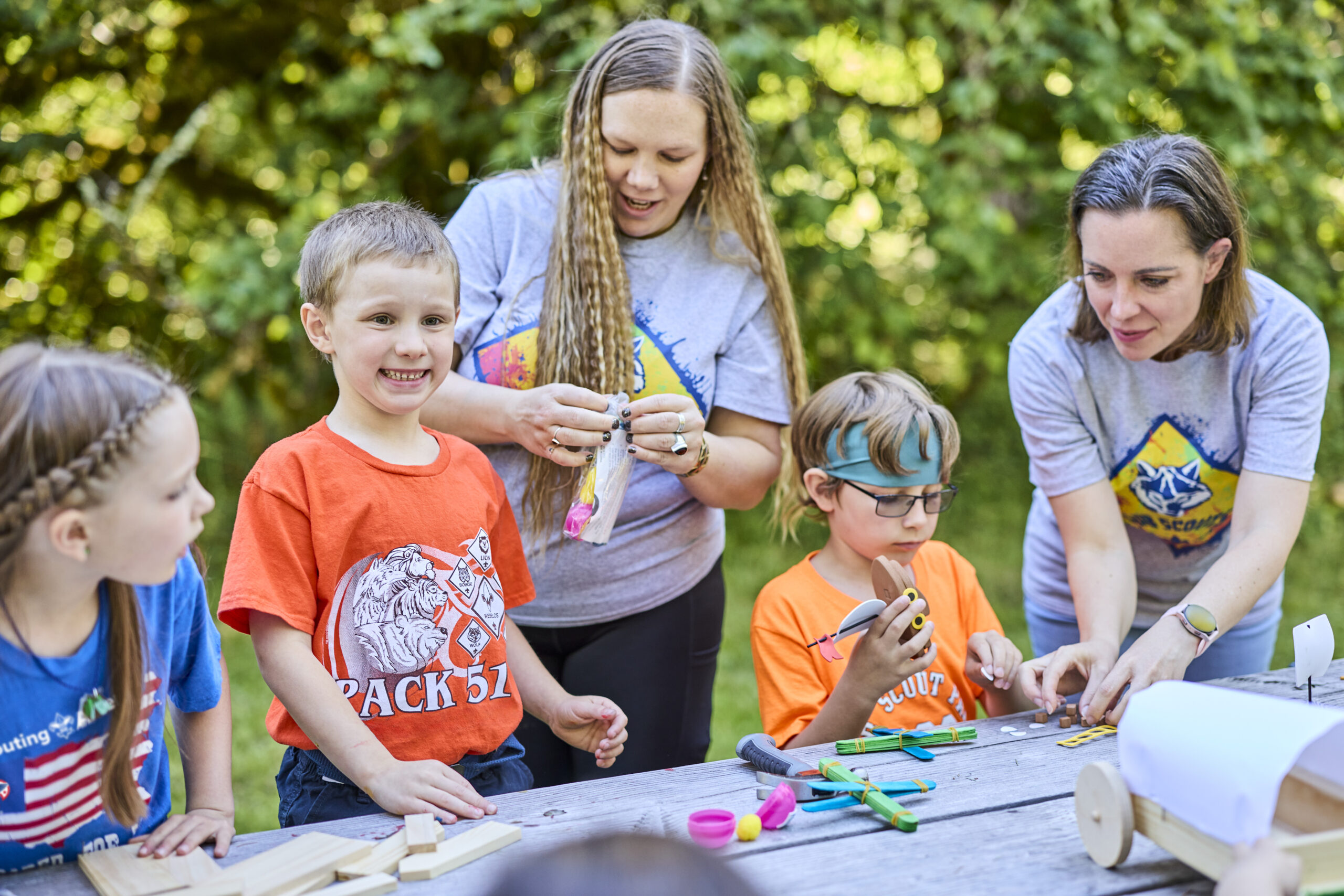 Cub Scouts making a popsicle stick catapult
